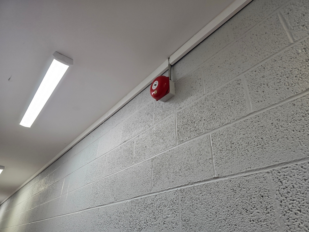 A,Fire,Alarm,Bell,Attached,To,The,Top,Of,A